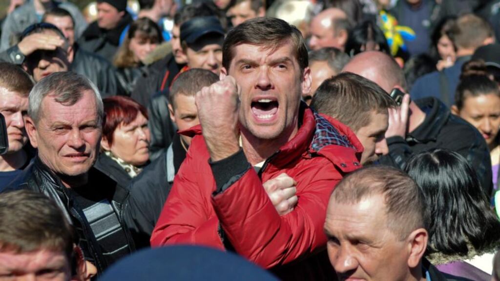 Pro-Russian activists attend a protest rally in central Donetsk yesterday. Photograph: Reuters