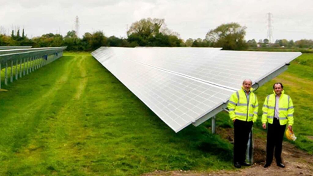 Neil Holman and David Maguire, founder directors of BNRG Renewables, at a solar park at Puriton in Somerset.