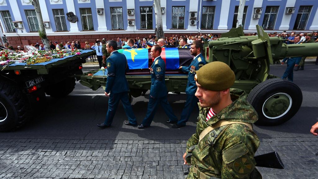 Pall bearers walk with the coffin of Alexander Zakharchenko in Donetsk. Photograph: Aleksey Filippov/AFP/Getty Images