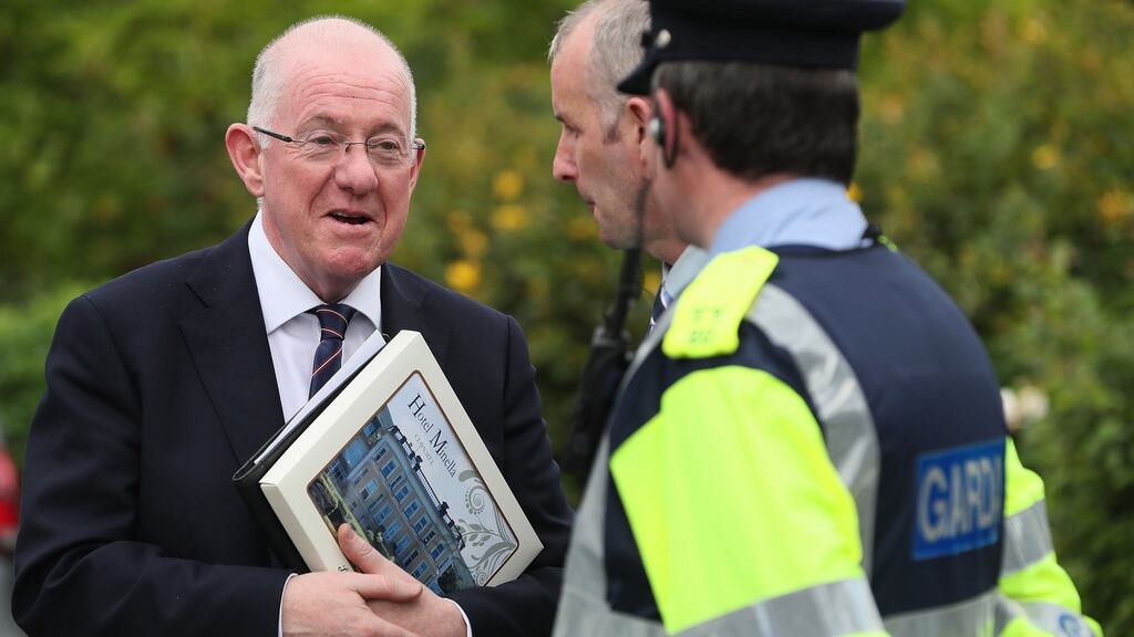Minster for Justice Charlie Flanagan speaking to a garda at Hotel Minella, Clonmel, where the Fine Gael think-in was taking place at the weekend ahead of the resumption of the Dáil next week. Photograph: Brian Lawless/PA Wire
