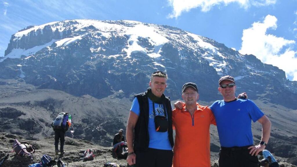 Kevin Gormley (centre) has become the oldest Irish person ever to reach the summit of Mount Kilimanjaro.