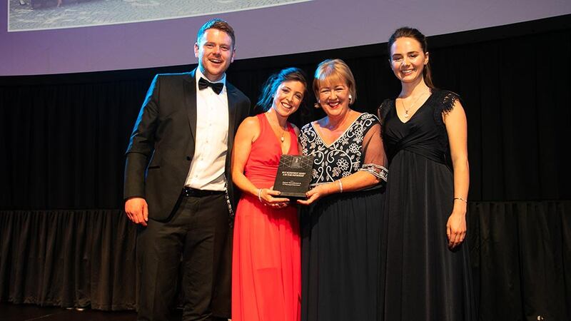 Brenda Dooley, Awards Head Judge, presents the Best Recruitment Agency & HR Team Partnership award to Tom Deane, Kate McGuinness & Emily Jones, Sigmar Recruitment.