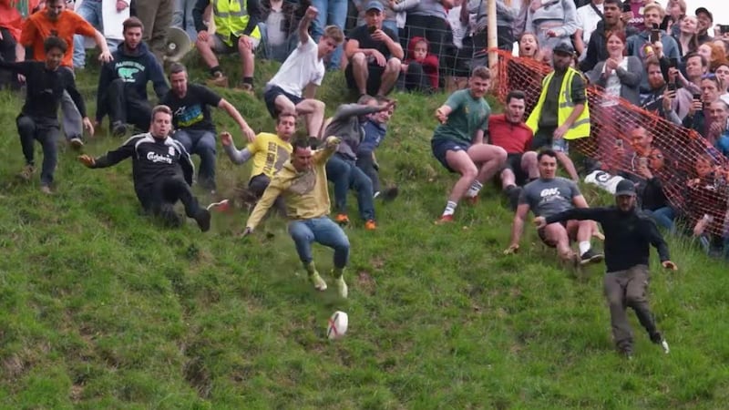 A cheese-rolling competition in We Are the Champions