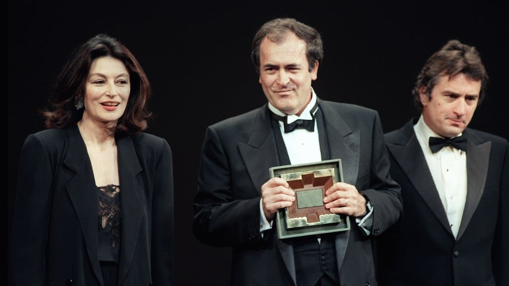 Actors Anouk Aimee and Robert De Niro present Bernardo Bertolucci with a special award for his film The Last Emperor during the 1987 Cannes International Film Festival. Photograph: AFP/Getty Images