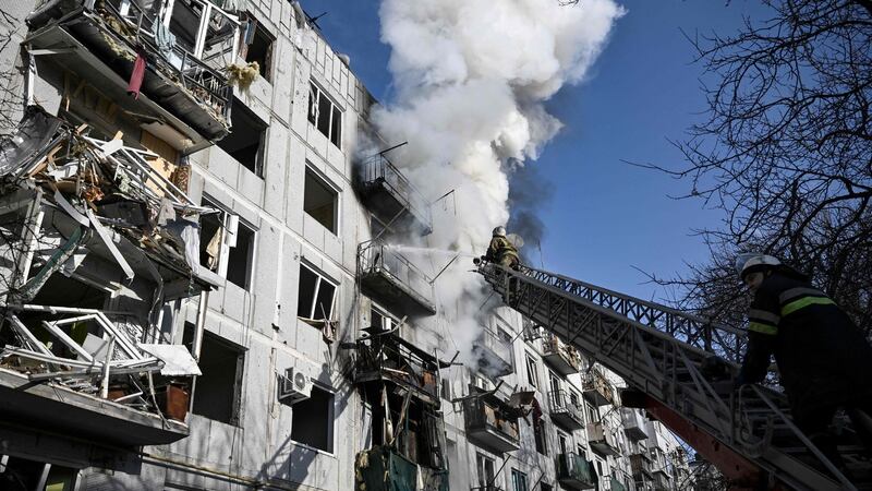 Firefighters work on a fire on a building after bombings on the eastern Ukraine town of Chuguiv on February 24th, 2022. Photograph: Aris Messinis/AFP via Getty Images