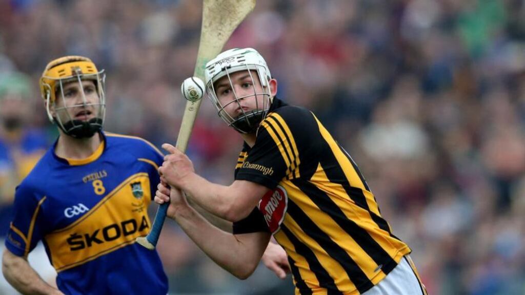 Kilkenny’s Padraig Walsh is chased down by Tipp’s Kieran Bergin