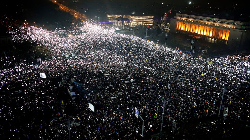 Tens of thousands of people gather for a demonstration in from of the government building in Bucharest, Romania on Sunday. Photograph: Darko Bandic/AP