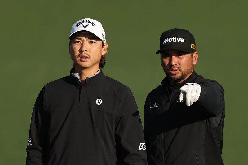 Min Woo Lee of Australia interacts with Jason Day of Australia on the second hole during a practice round. Photograph: Richard Heathcote/Getty