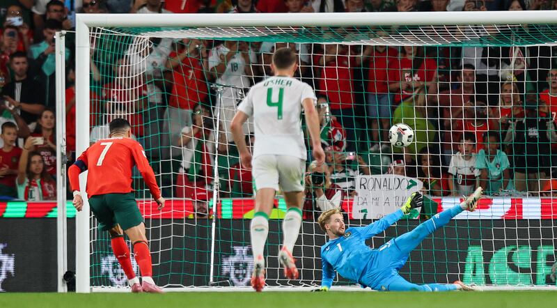 Ireland goalkeeper Caoimhín Kelleher saves a penalty from Portugal’s Cristiano Ronaldo. Photograph: Ryan Byrne/Inpho