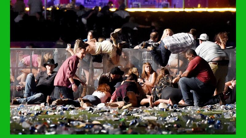 People scramble for safety at the Route 91 Harvest country music festival in Las Vegas after Stephen Paddock opened fire on the crowd from the 32nd floor of the Mandalay Bay Hotel. Photograph: David Becker/Getty Images