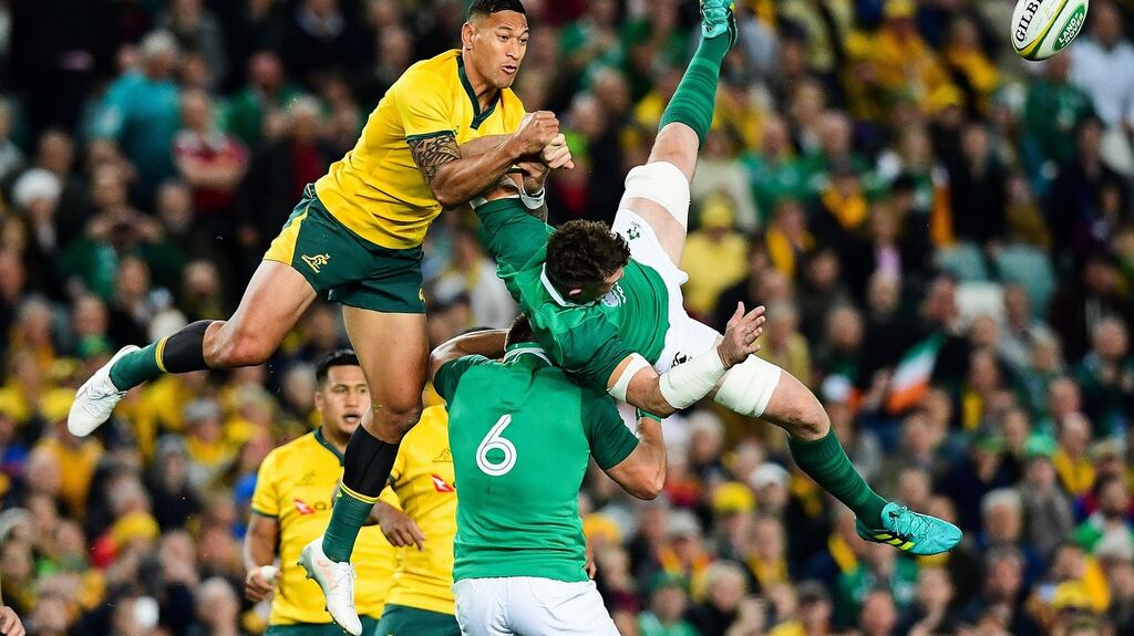 Israel Folau takes out Peter O’Mahony in Sydney, earning himself a yellow card. Photograph: Stuart Walmsley/Photosport/Inpho