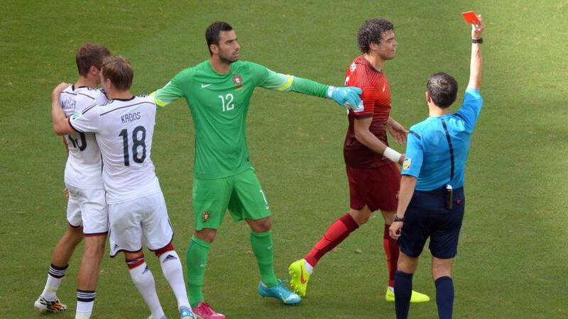 Referee Milorad Mazic gives Pepe his marching orders after his clash with Thomas Müller in Portugal’s opening World Cup Group G clash with Germany in Salvador. Photograph: Thomas Eisenhuth.
