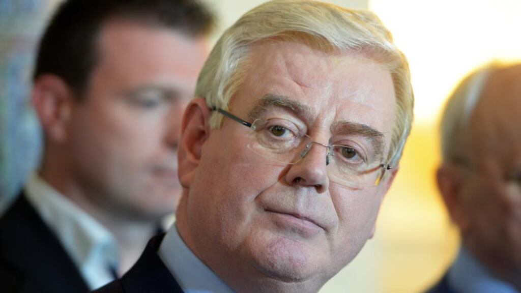 Tánaiste and Minister for Foreign Affairs Eamon Gilmore at the announcement of his resignation yesterday: his successor will be under extreme pressure to rebuild a battered party. Photograph: Eric Luke