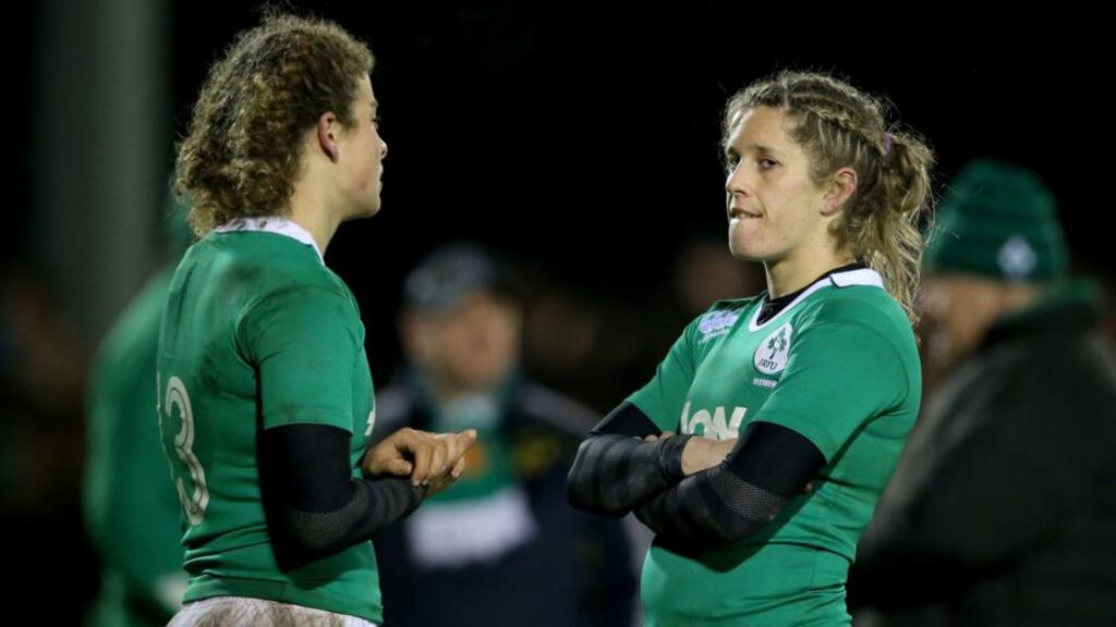 Ireland’s Jenny Murphy and Alison Miller are dejected after defeat to France. Photograph: Dan Sheridan/Inpho