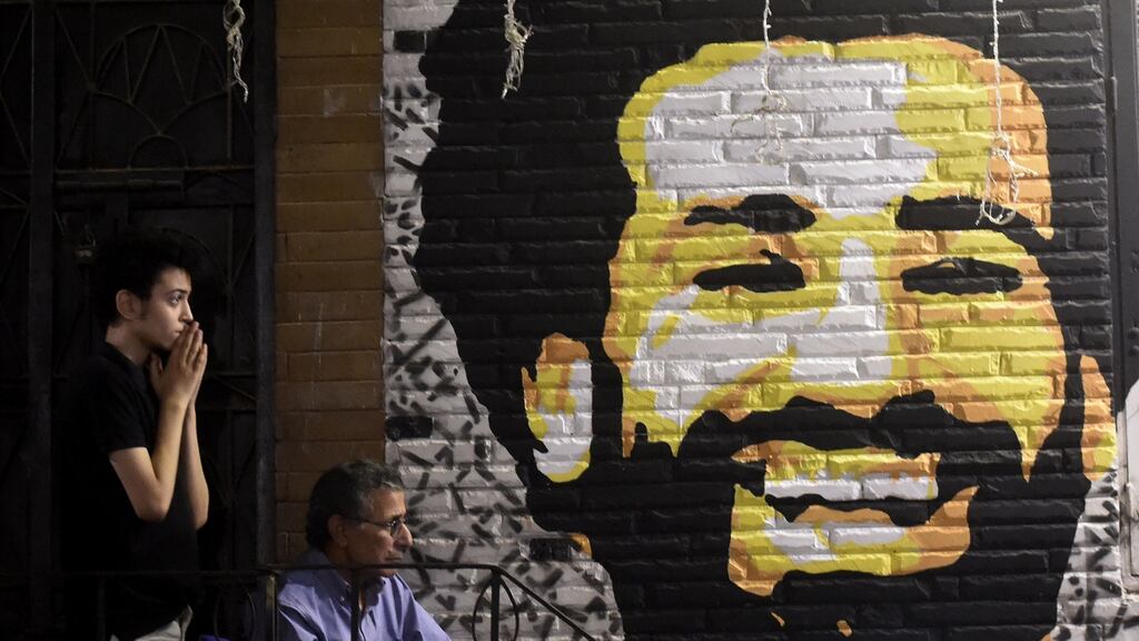Egyptian fans watch the Champions League final between Real Madrid and Liverpool in Cairo. Mohamed Salah suffered a shoulder injury in the game that could limit his involvment in Russia. Photograph: Getty Images