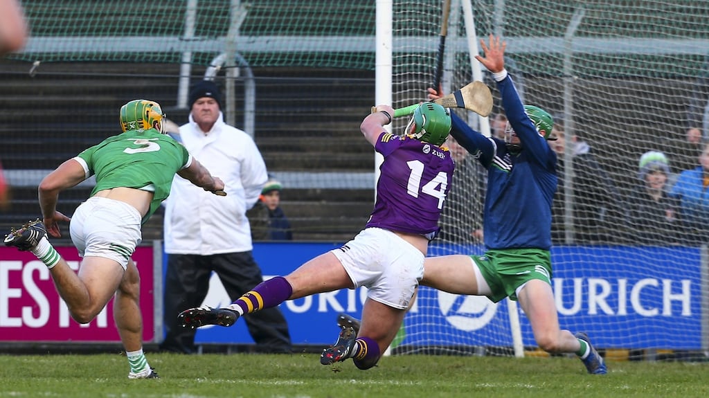 Wexford’s Conor McDonald flicks the ball over Limerick goalkeeper Nicky Quaid. Photograph: Ken Sutton/Inpho