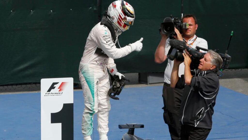 Mercedes driver Lewis Hamilton celebrates a victory in the  Canadian F1 Grand Prix at the Circuit Gilles Villeneuve in Montreal. Photo: Chris Wattie/Reuters