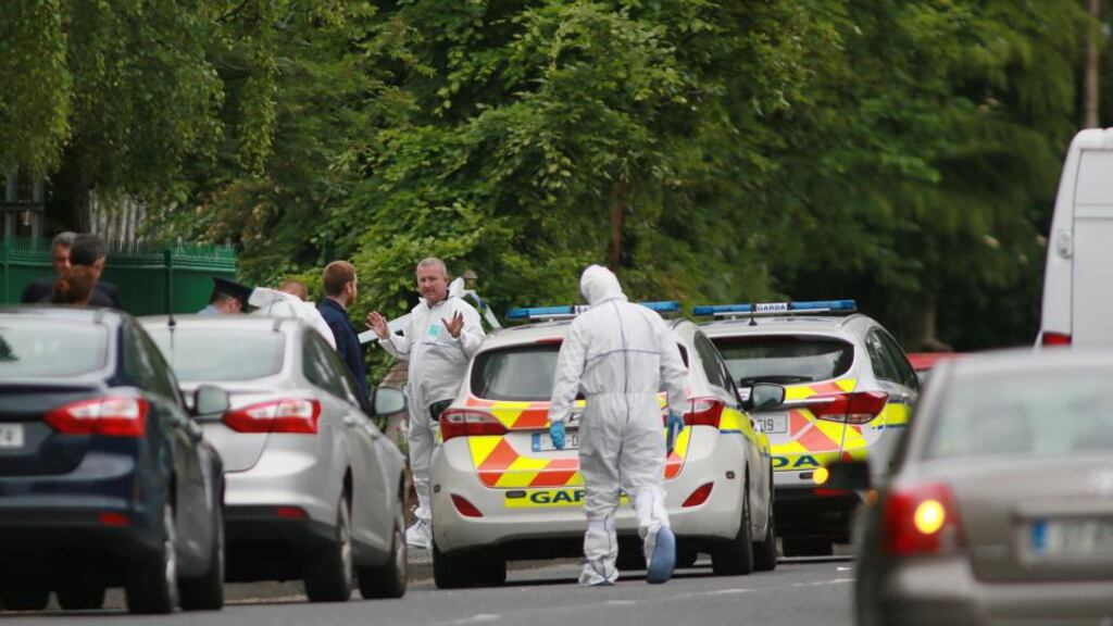 Gardaí near the scene of a shooting in Blanchardstown in Dublin on Friday. Photograph: Paddy Cummins/PCPhoto.ie