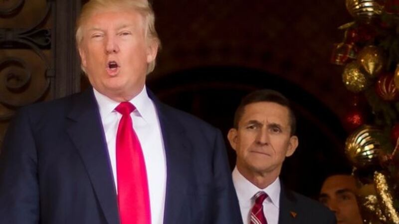 Donald Trump with his former security adviser Michael Flynn (right). Photograph: Jim Watson/AFP/Getty Images