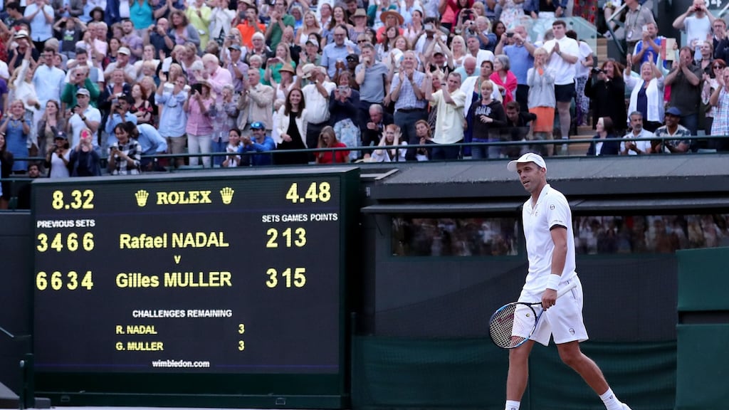 Gilles Muller reacts after beating Rafael Nadal on day seven of the Wimbledon Championships at The All England Lawn Tennis and Croquet Club, Wimbledon. Photo: Gareth Fuller/PA