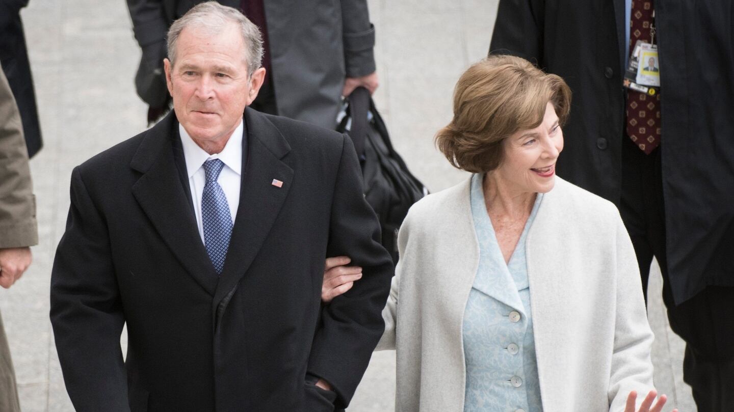 Former US president George W. Bush and his wife Laura Bush arrive before the inauguration . Photograph: Jack Gruber/EPA