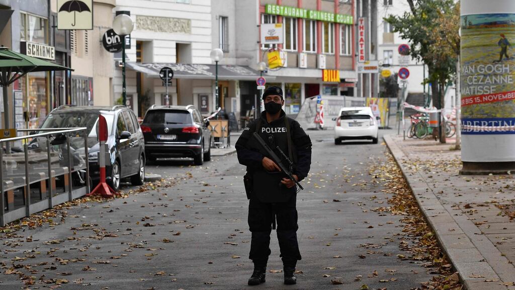 A policeman stands guard close to crime scene in Vienna. Photograph: Joe Klamar/AFP