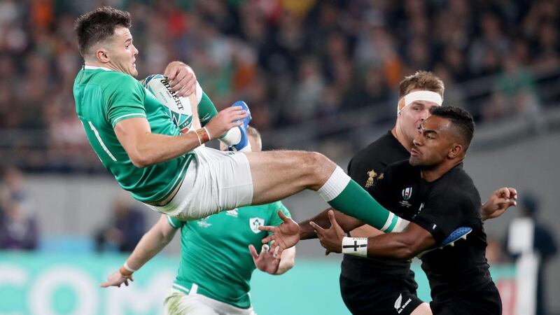 Ireland’s Jacob Stockdale catches the ball ahead of New Zealand’s Sevu Reece during the Rugby World Cup quarter-final in Tokyo. Photograph: Dan Sheridan/Inpho