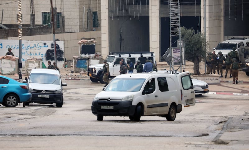 Israeli security personnel monitor the area following a shooting attack in the West Bank town of Hawara, near the city of Nablus, on Sunday. Photograph: Alaa Badarneh/EPA