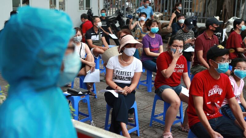 People wait in line for Covid-19 test in Hanoi, Vietnam. Photograph: Hau Dinh/AP