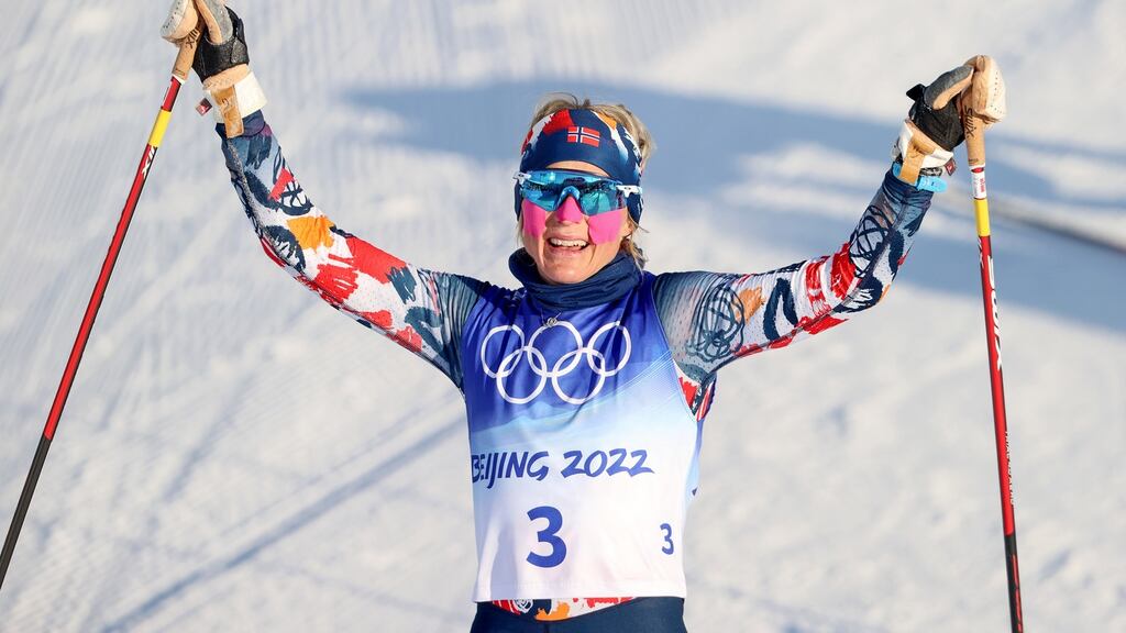 Therese Johaug of Norway celebrates winning the race. Photograph: Bryan Keane/Inpho