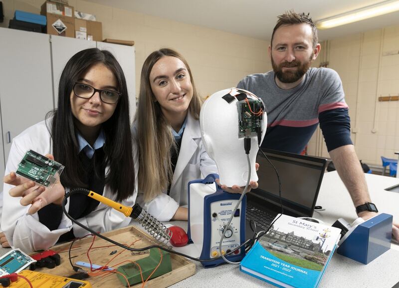 Teacher Rory Coote with students Sophie Creedon and Lydia Kelleher from St Mary’s secondary school in Mallow, Co Cork. The team’s project is an ‘investigation into sports-related cranial impacts and the design and development of wearable technology to better enable the measurement and recording of such head impacts’. Photograph: Fennell Photography