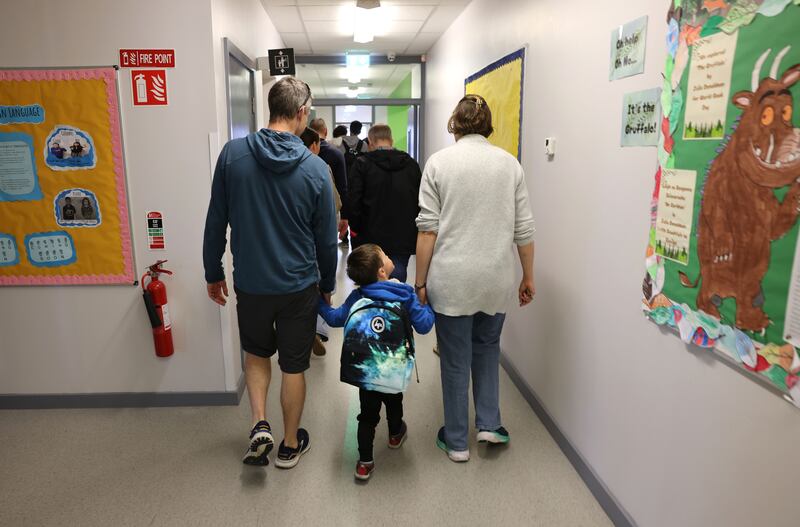 Parents and children arrive at Broombridge ETNS in Cabra, Dublin. Photograph: Dara Mac Dónaill