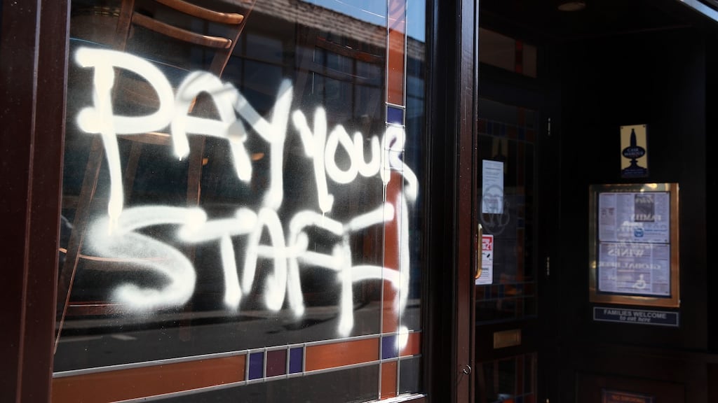 Graffiti on a JD Wetherspoon pub in Crystal Palace, south London. Wetherspoon workers have described founder Tim Martin’s lack of support for his chain’s 40,000 employees as “absolutely outrageous”. Photograph: Adam Davy/PA Wire