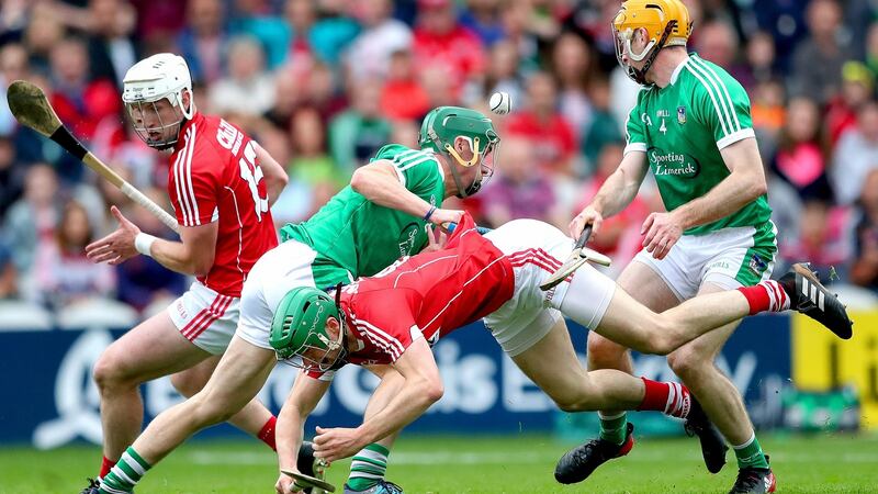 Cork’s Pat Horgan and Seamus Harnedy clash with Sean Finn and Richie English of Limerick. Photo: James Crombie/Inpho