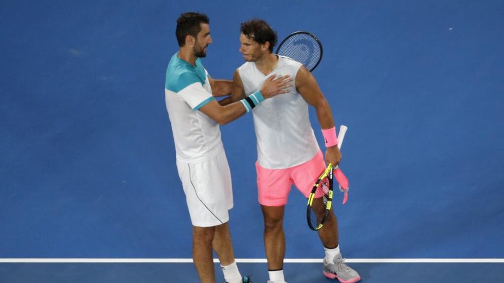 Marin Cilic of Croatia and Rafael Nadal of Spain embrace after Nadal retired from their match at the Australian Open. Photo: Toru Hanai/Reuters