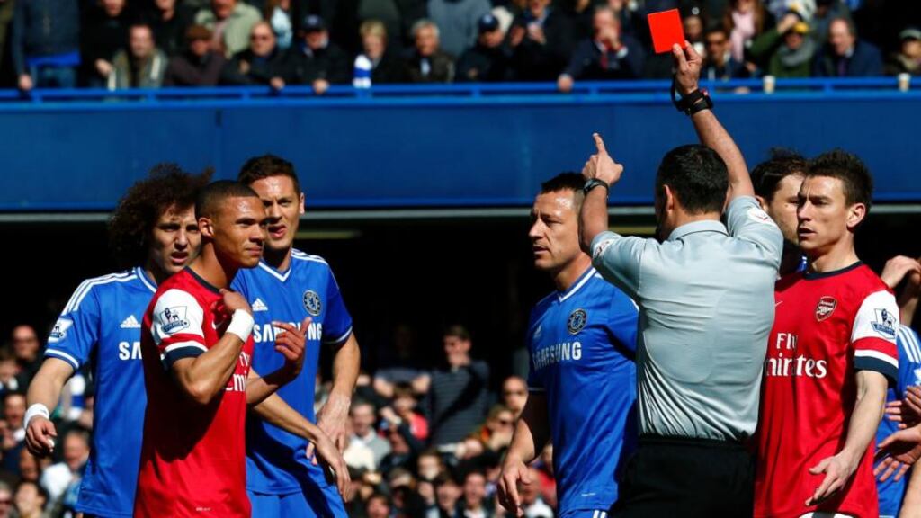 Arsenal’s Kieran Gibbs reacts after he is wrongly shown a red card by referee Andre Marriner during their Premier League match against Chelsea at Stamford Bridge. Photograph: Eddie Keogh/Reuters
