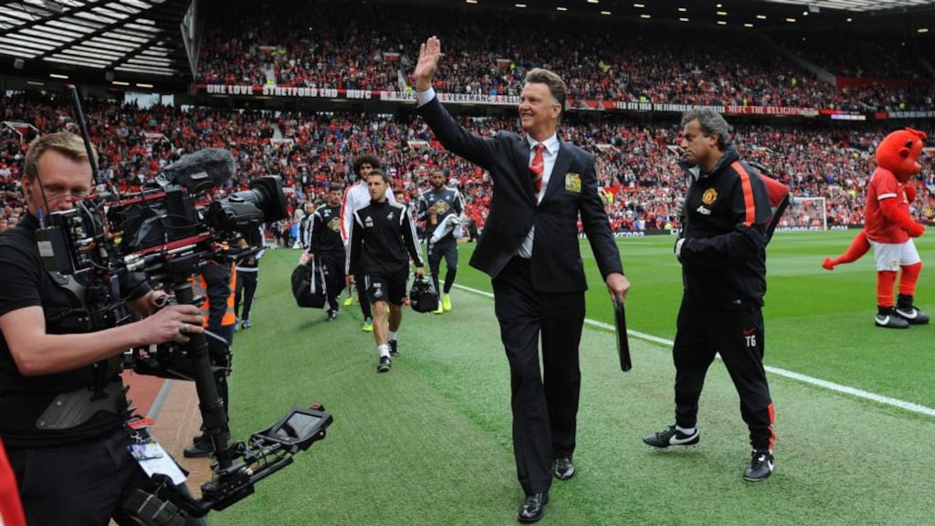 Manchester United manager Louis van Gaal waves to the Old Trafford crowd. Photograph: Peter Powell / EPA