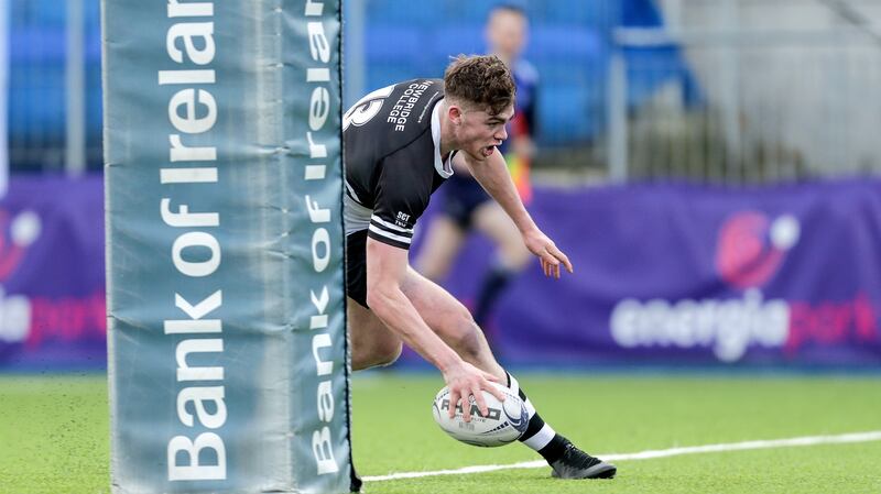 Marcus Kiely scores a try for Newbridge College. Photograph: Laszlo Geczo/Inpho