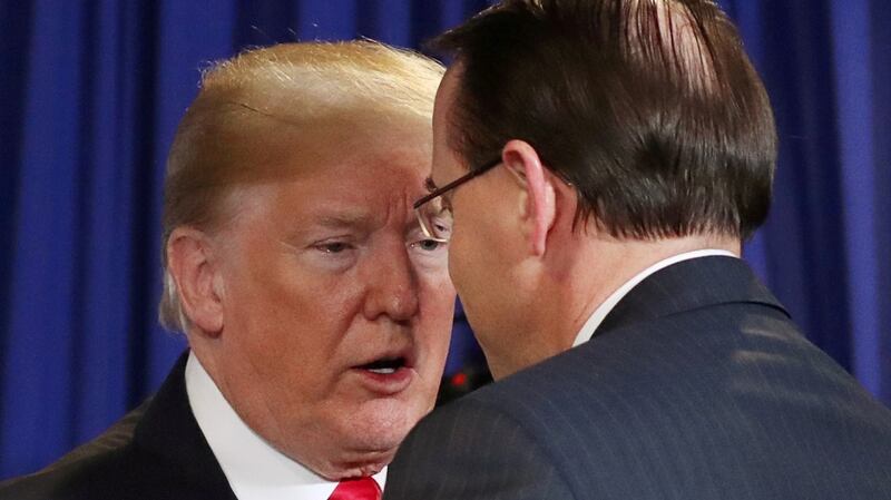 Donald Trump shakes hands with  Rod Rosenstein at a roundtable on immigration in  New York last May. Photograph: Kevin Lamarque/File Photo/Reuters