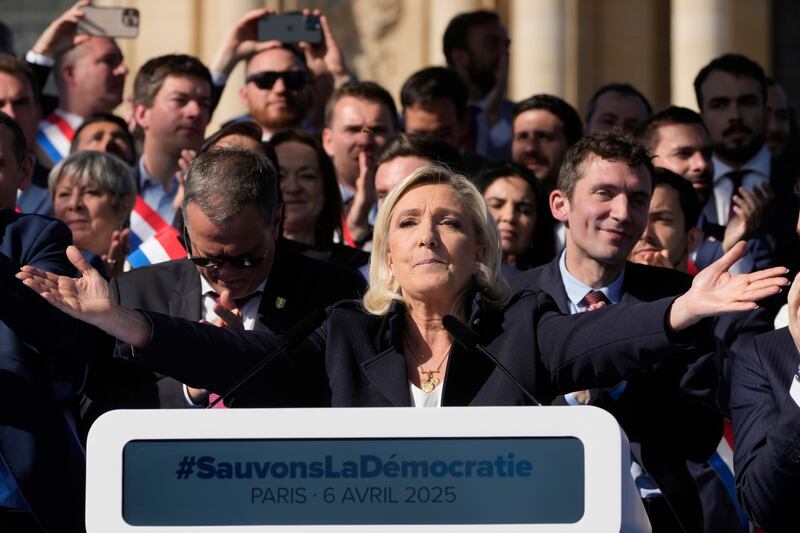 Marine Le Pen delivers her speech during the rally in Paris. Photograph: Michel Euler/AP
