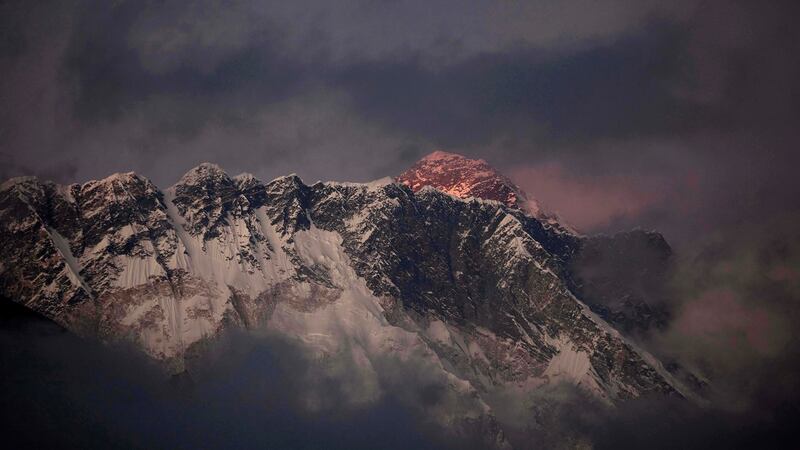 Sun sets on Mount Everest seen behind Mount Nuptse. Photograph: AP
