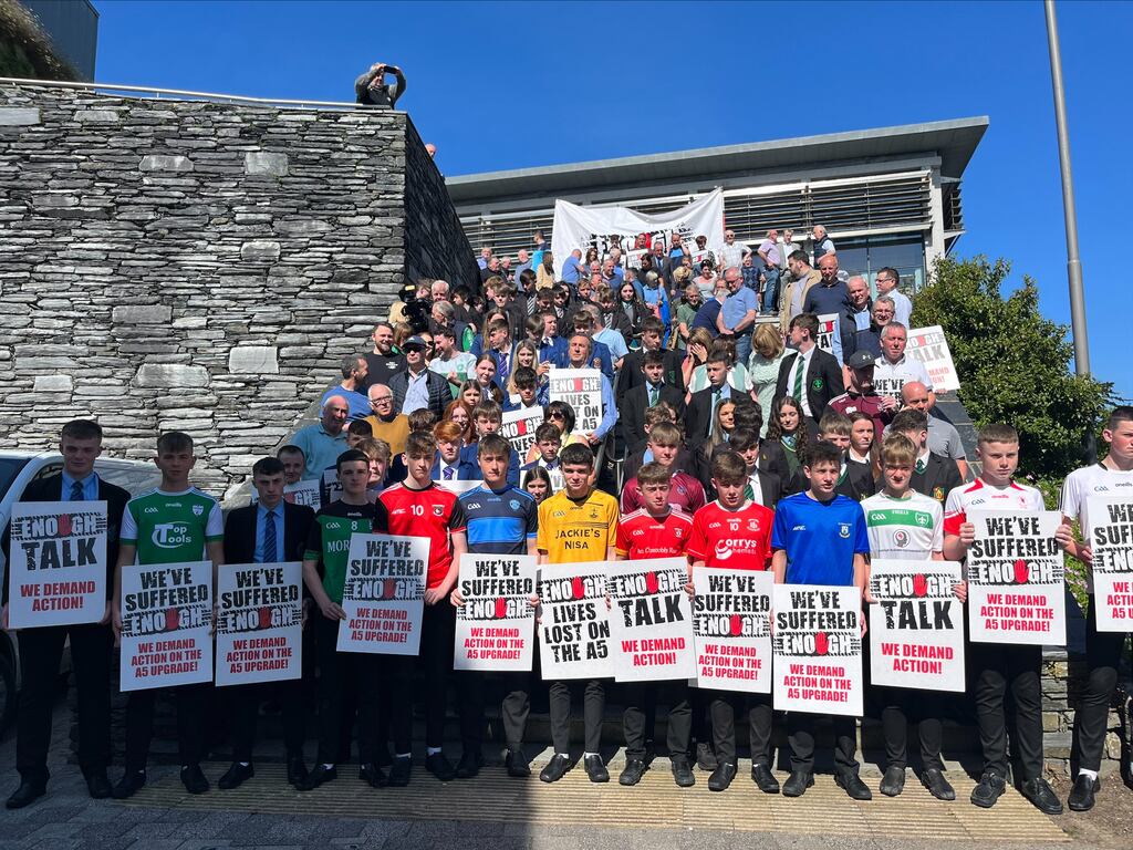 People gathered outside the Strule Arts Centre in Omagh where a public inquiry is being held examining the proposals for a new dual carriageway along the route of the A5. Photograph: Claudia Savage/PA Wire