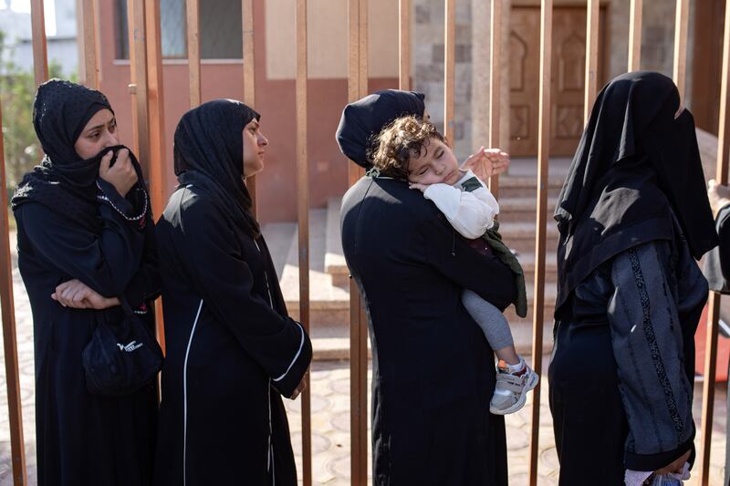 Palestinians mourn next to the bodies of their relatives who were killed following an Israeli strike that hit a school in the Gaza Strip. Photograph: Haitham Imad/EPA