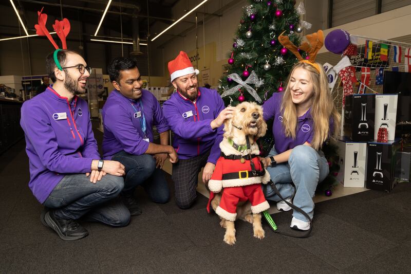 Staff throughout Currys' 16 stores help fundraise for the charity My Canine Companion through various activities. Shown here are Louis Wild, Jibin Michael, Nick Arnold, and Gabriela Zamberga with Jack at Mahon Point, Cork.