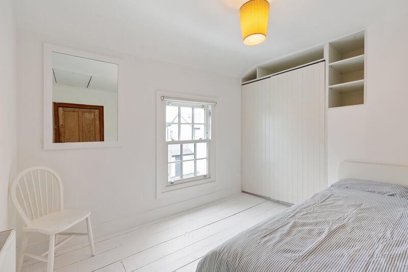 Second bedroom with attic access. Photograph: Viv van der Holst