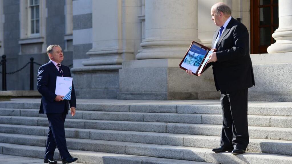 ‘It is clear that the political system will not be able to tolerate the full €2 billion in adjustments previously pencilled in. A political crisis followed by a general election in the next few months is not in this country’s economic interest.’ Above, Minister for Finance Michael Noonan and Brendan Howlin Minister for Public Expenditure and Reform at Government Buildings before delivering last October’s Budget to the House. Photograph: Bryan O’Brien / THE IRISH TIMES