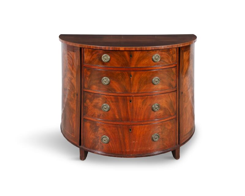 This north European inlaid fruitwood commode is decorated with flowers, musical instruments and birds of paradise