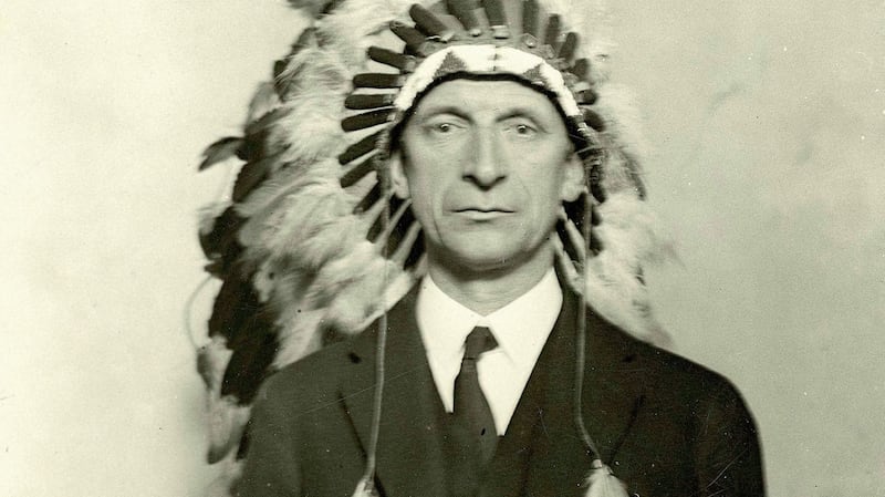 Éamon de Valera wearing a native American ceremonial head-dress. He was made chief of a Chippewa tribe of Indians at the Chippewa Reservation Reserve, Wisconsin when he visited it on October 18th, 1919. Photograph: taken from Judging Dev, by Diarmaid Ferriter, published by Royal Irish Academy