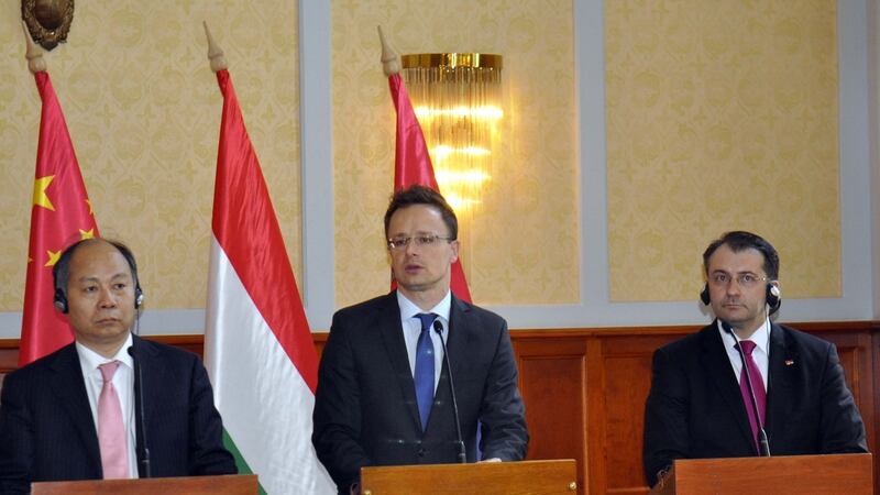 Hungarian minister for foreign affairs and trade Peter Szijjarto (centre), Dejan Trifunovic, state secretary for the ministry of construction (right) and Vang Hsziao-tao, vice-chairman of China’s National Development and Reform Commission, hold a joint press conference following their meeting on the modernisation of the Belgrade-Budapest rail line, in Budapest, Hungary, in July 2015. Photograph: Mehmet Yilmaz/Anadolu Agency/Getty Images