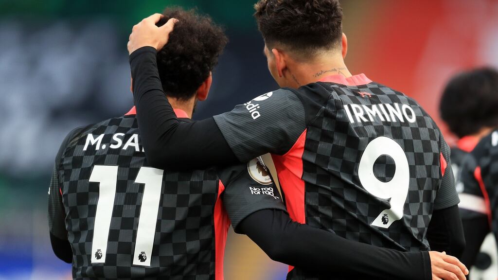 Liverpool’s Roberto Firmino celebrates with Mohamed Salah during the Premier League win over Crystal Palace. Photo: Adam Davy/Getty Images